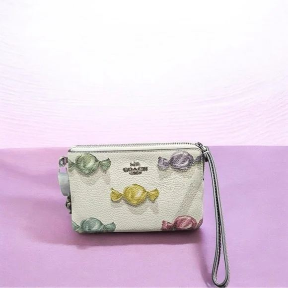 Coach Corner Zip Wristlet in
Candy Print with Charm Refined
Pebble Leather NWT - Picture 6 of 7
